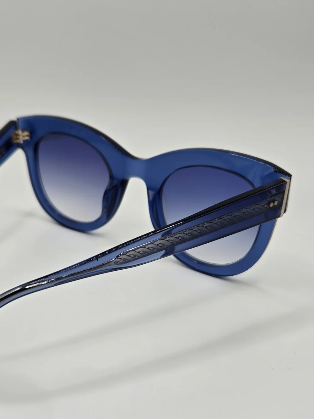 Aperçu sunglasses featuring a bold acetate frame and gold tone branding